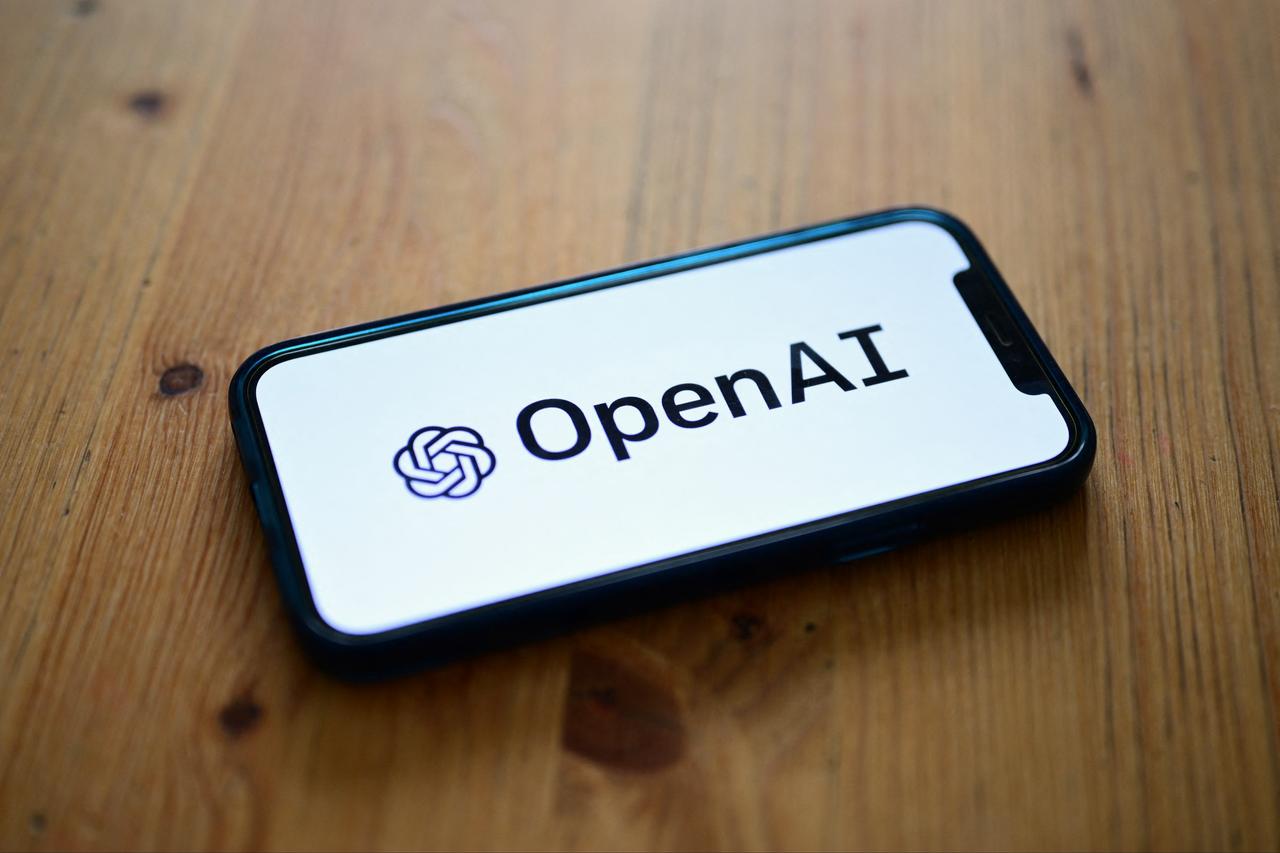 A photo, shows a smartphone displaying the logo of the artificial intelligence OpenAI research laboratory taken on October 4, 2023 in Manta, near Turin. (AFP Photo)