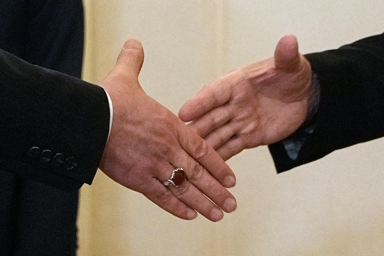 Russian President Vladimir Putin shakes hands with Iranian Foreign Minister Abbas Araghchi during their meeting at the Boris Yeltsin Presidential Library in Saint Petersburg on April 27, 2026. (AFP Photo)