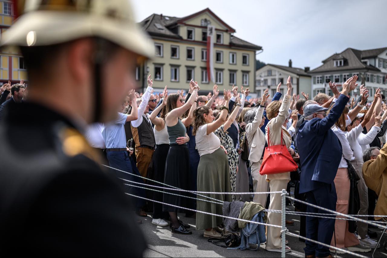 Citizens vote by raising their hands during the Landsgemeinde, a traditional public, non-secret ballot conducted by majority rule, in Appenzell, eastern Switzerland, on April 26, 2026. (AFP Photo)