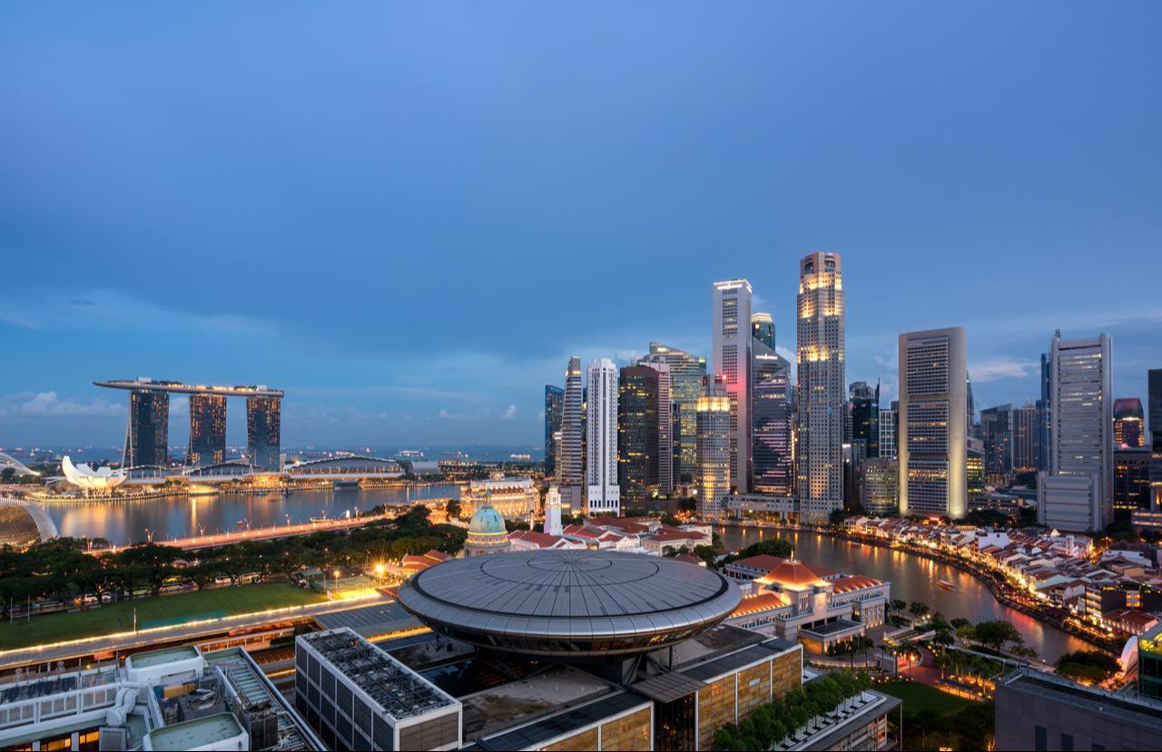 A panoramic view of Singapore’s Marina Bay and central business district skyline is seen at night (Adobe Stock Photo)
