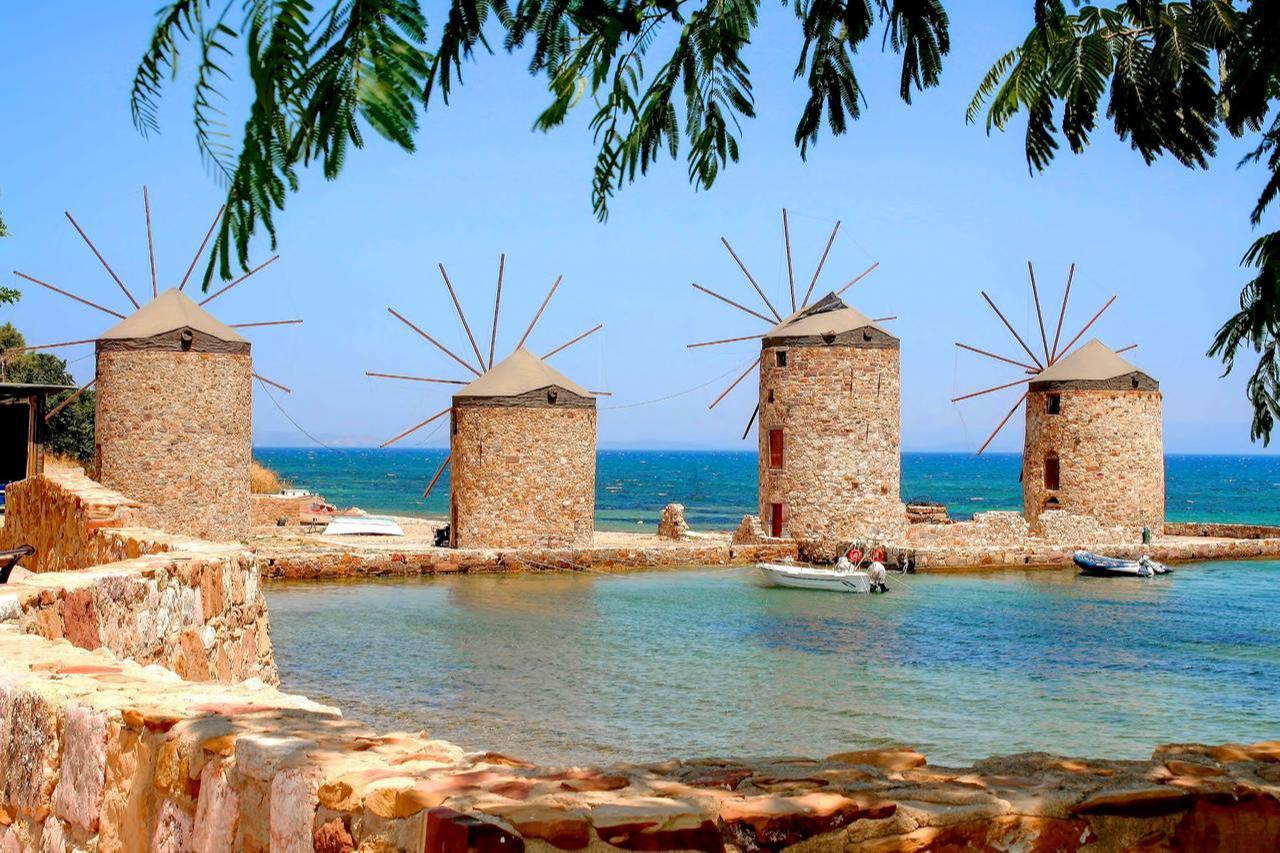 The four windmills of Chios Island, Greece, standing as a historic landmark and a symbol of the island. (Adobe Stock Photo)