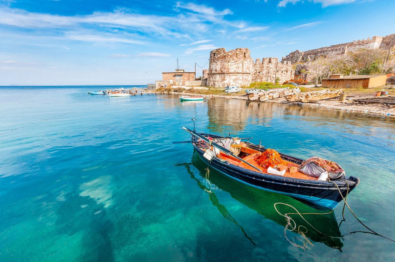 Fishing boats docked near the historic port of Lesbos, Greece. (Adobe Stock Photo)