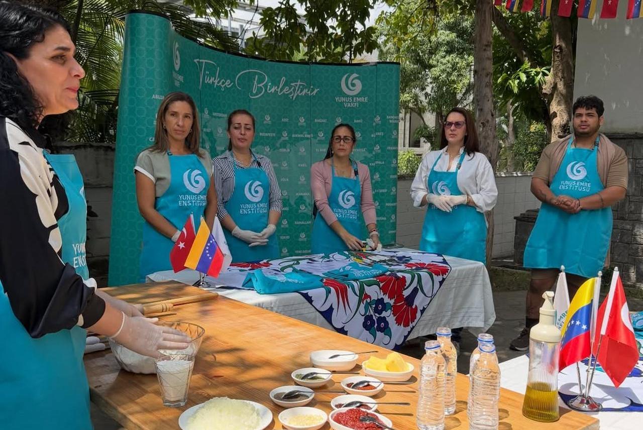 A live cooking demonstration shows the preparation stages of manti as attendees follow along during the event in Caracas, Venezuela. (Photo via Instagram/@yeecaracas)