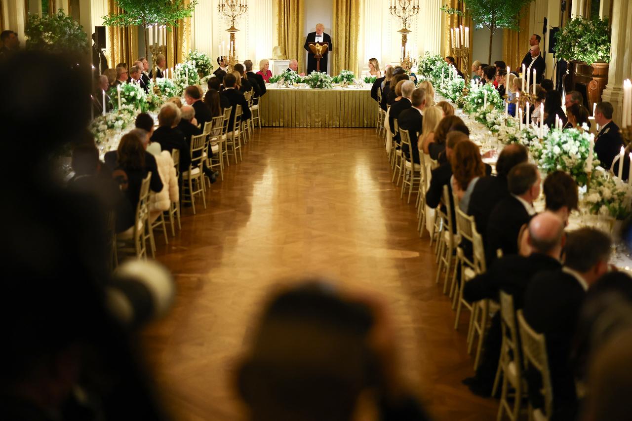 Guests listen to US President Donald Trump speak during a State Dinner in honor of Britain's King Charles III and Queen Camilla in the East Room of the White House in Washington, DC, April 28, 2026. (AFP Photo)