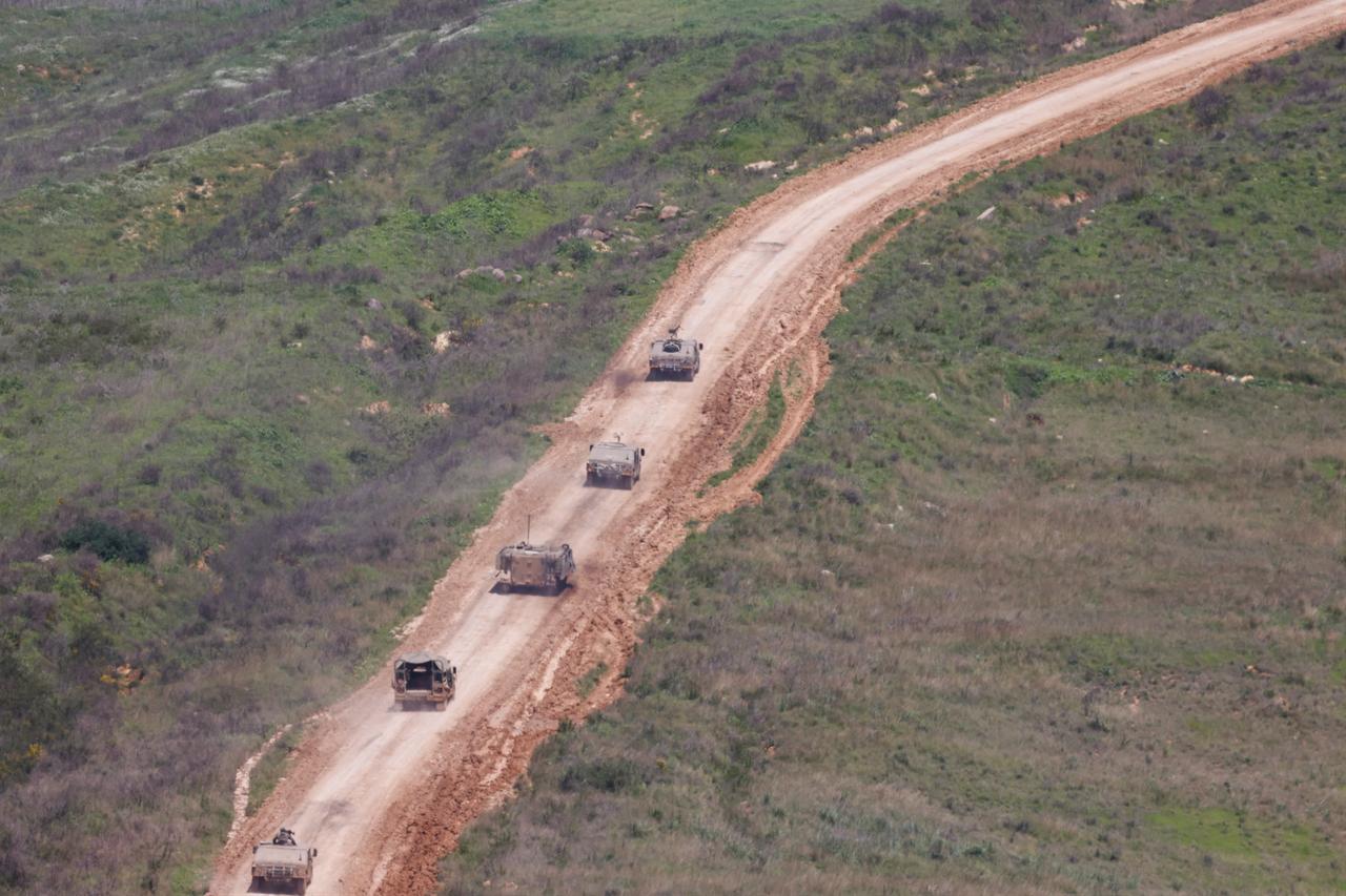 Israeli army vehicles move at a position in southern Lebanon by the border with northern Israel on March 28, 2026. (AFP Photo)