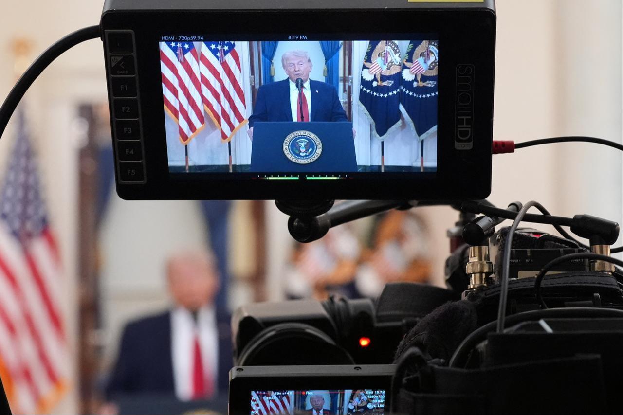 A camera screen shows US President Donald Trump speaking during a televised address on the conflict in the Middle East from the Cross Hall of the White House in Washington, DC, April 1, 2026. (AFP Photo)