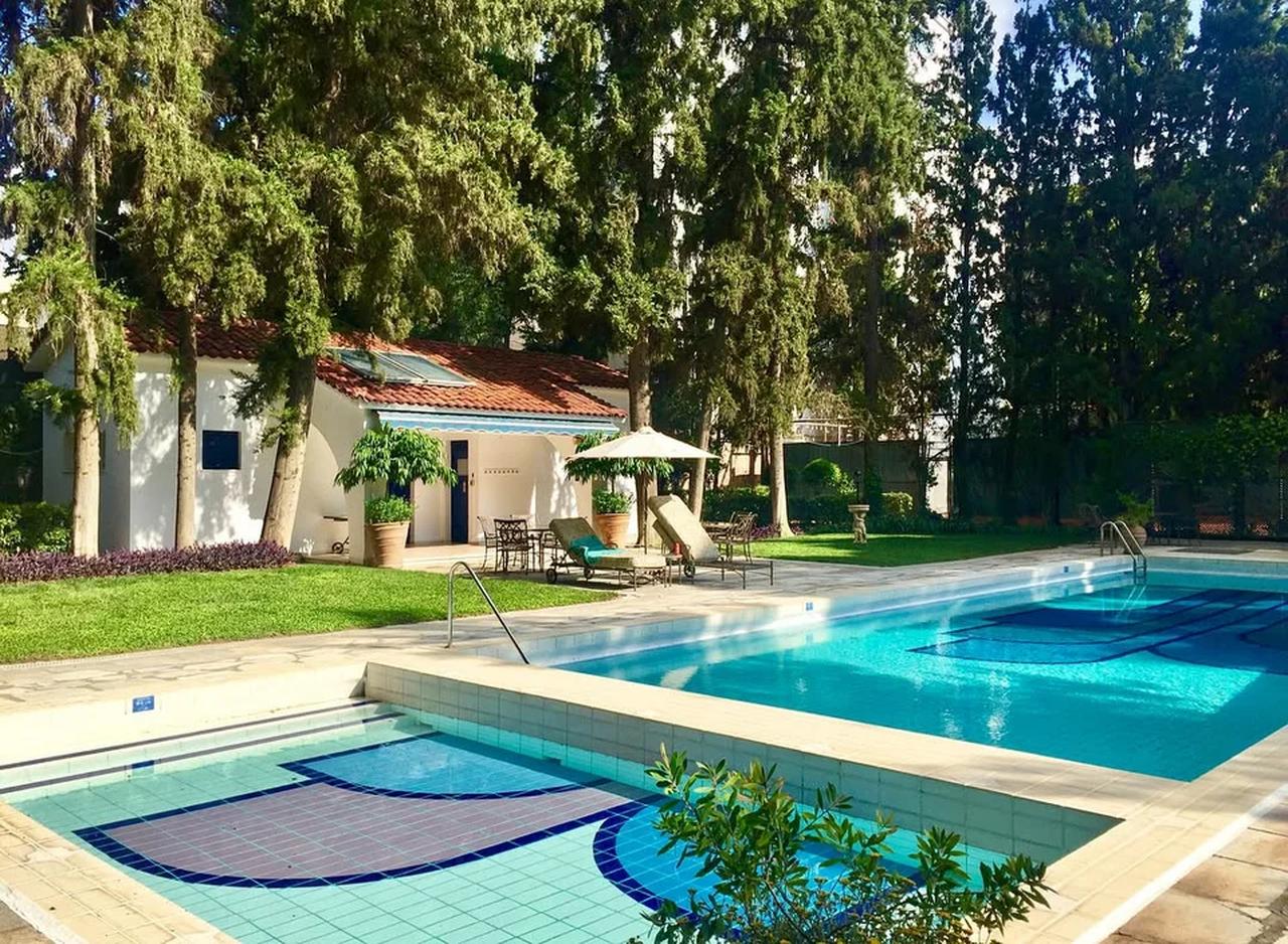 A swimming pool and garden area at the U.S. ambassador’s residence in Athens, Greece. (Photo via iefimerida)