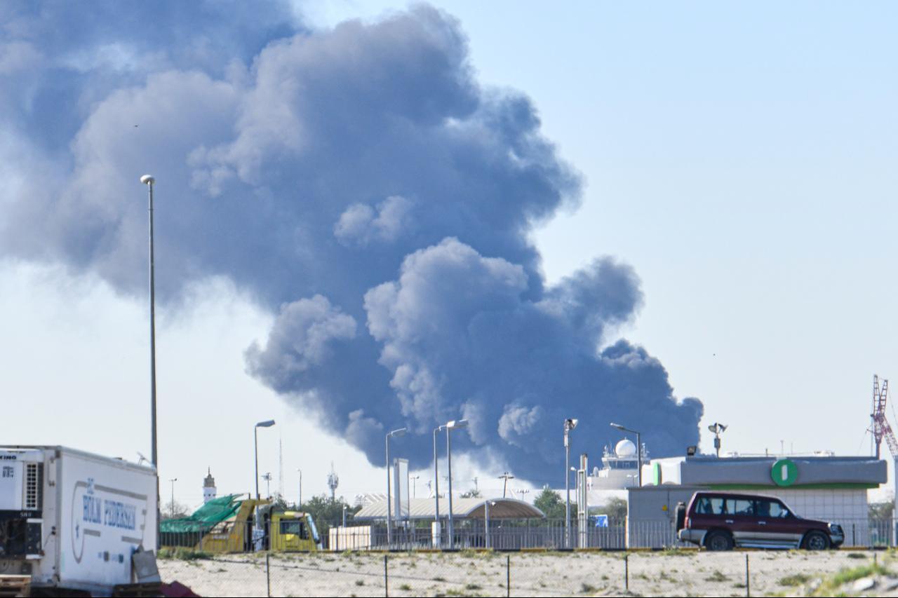 Smoke rises after an Iranian drone attack struck fuel tanks at Kuwait International Airport in Kuwait City, Kuwait, on April 1, 2026. (AA Photo)