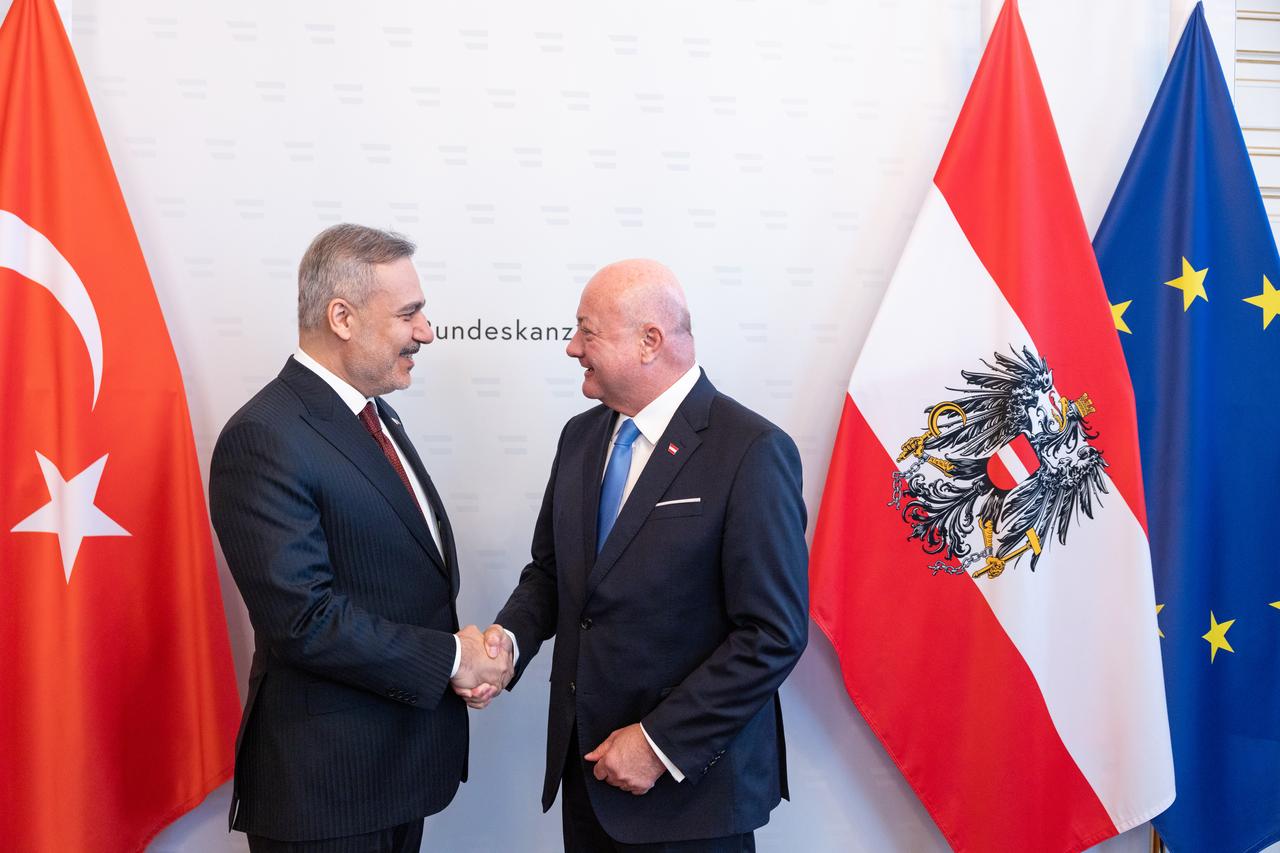 Turkish Foreign Minister Hakan Fidan (L) is received by Austrian Chancellor Christian Stocker (R) during his official visit to Vienna, Austria, April 29, 2026. (AA Photo)