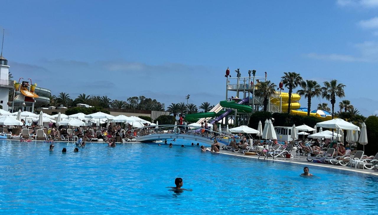 Tourists relax by a large resort pool in Antalya, April 30, 2026. (AA Photo)