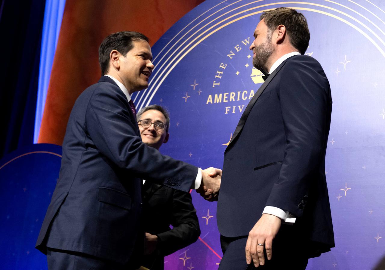 This image captures a moment in time featuring Vice President JD Vance and Secretary of State Marco Rubio at the American Compass Fifth Anniversary Gala in June 2025.