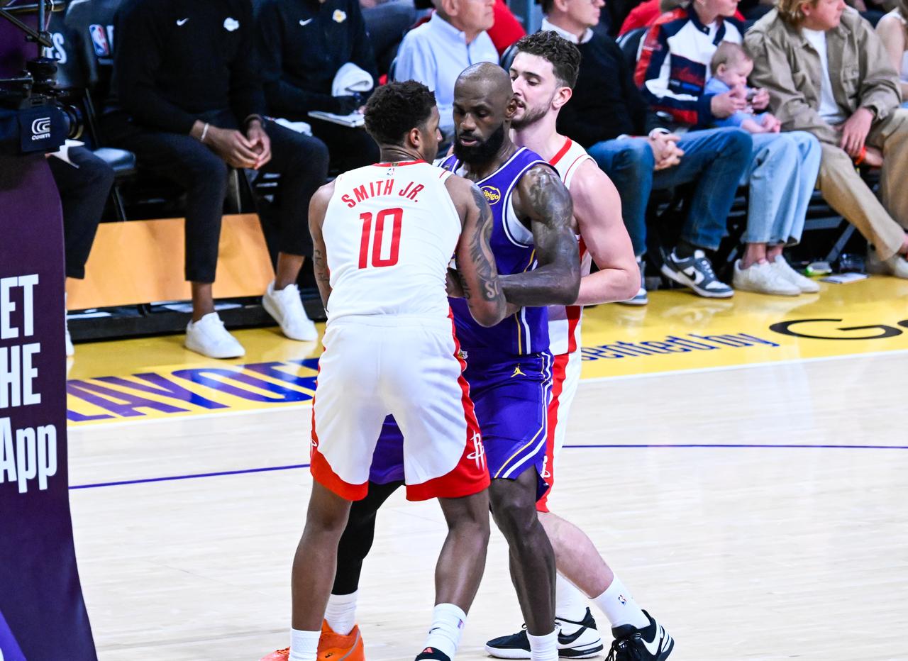 Alperen Sengun (L) and Jabari Smith Jr. (10) of Rockets in action against LeBron James (C) of the Lakers during the NBA playoffs game 5, Los Angeles, California, United States, April 29, 2026. (AA Photo)