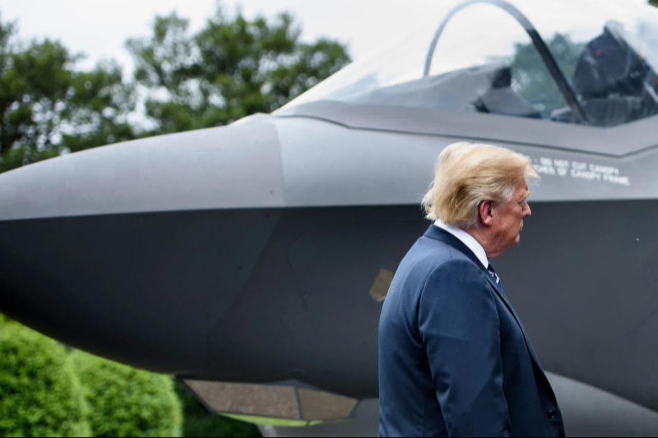 The image shows U.S. President Donald Trump standing next to the nose of an F-35 fighter jet, accessed on February 17, 2026. (AFP Photo)
