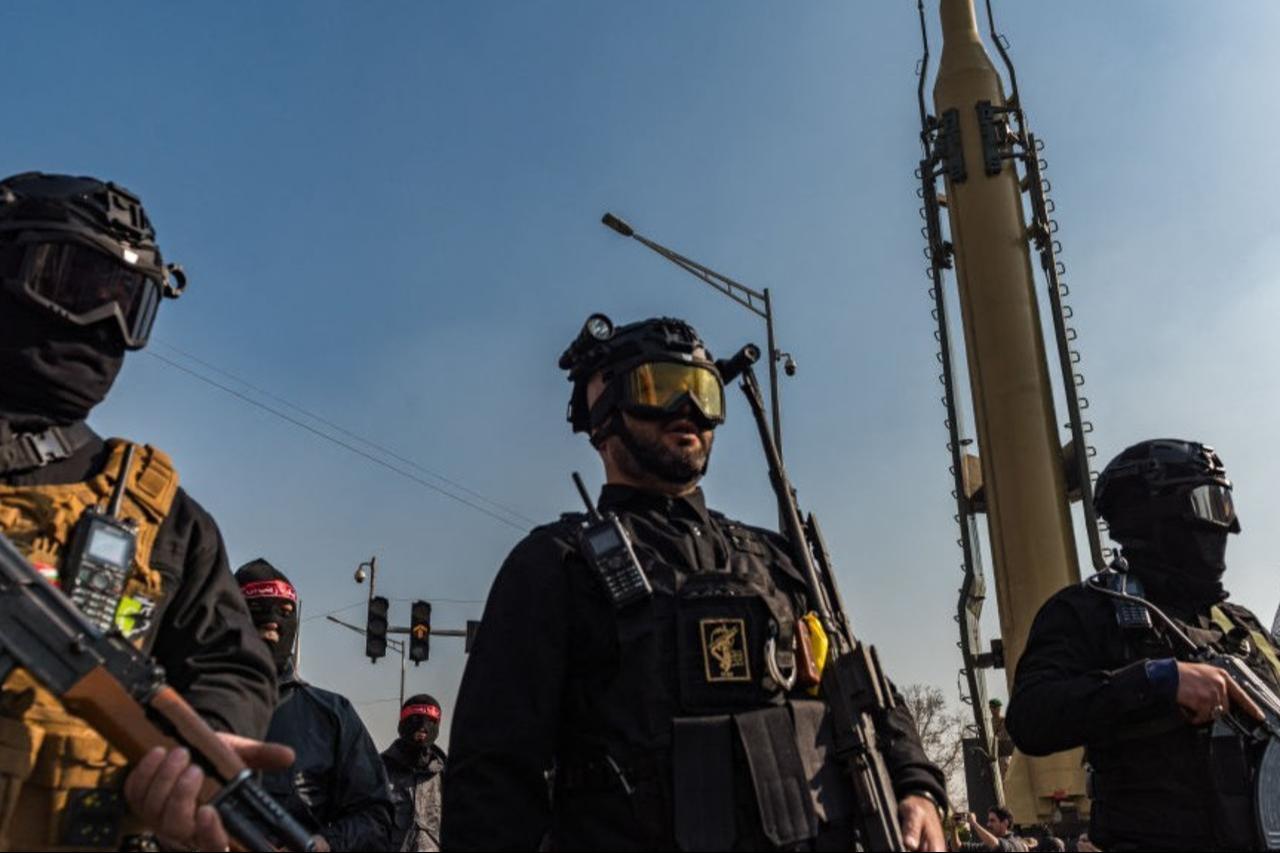 Masked and goggled Iranian Basij militants and IRGC personnel carry AK-47s during a parade of an alleged 110,000 paramilitary Basij and IRGC forces in downtown Tehran, Iran, on January 10, 2025. (AFP Photo)