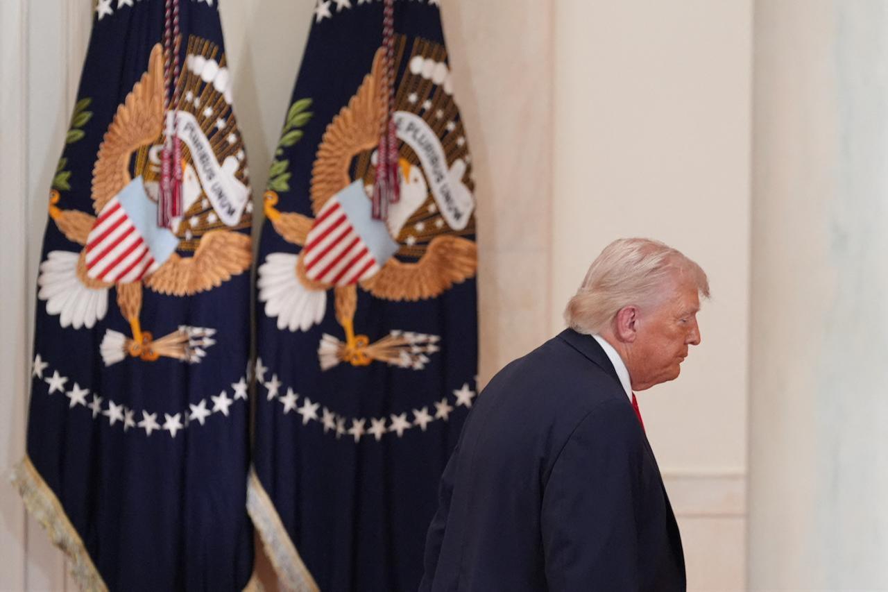 US President Donald Trump leaves after speaking at a televised address on the conflict in the Middle East from the Cross Hall of the White House in Washington, DC, April 1, 2026. (AFP Photo)
