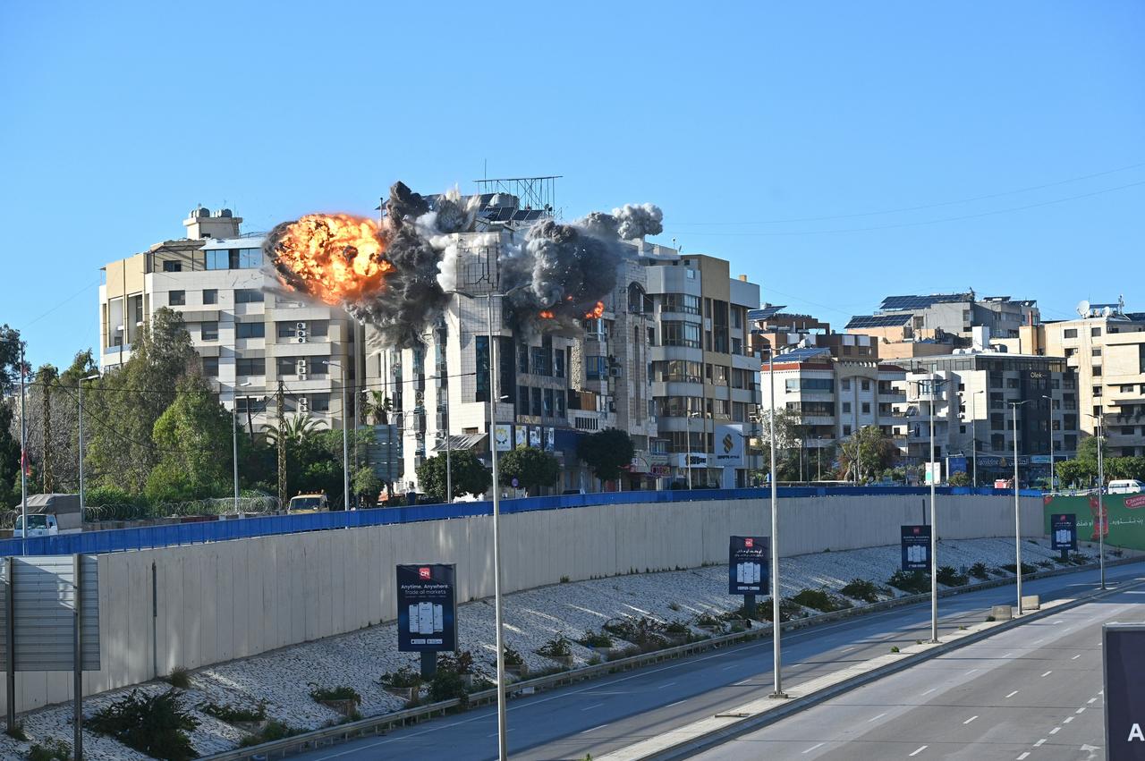 A ball of fire rises from the site of an Israeli strike that targeted a building adjacent to the highway that leads to Beirut's international airport on March 31, 2026. (AFP Photo)
