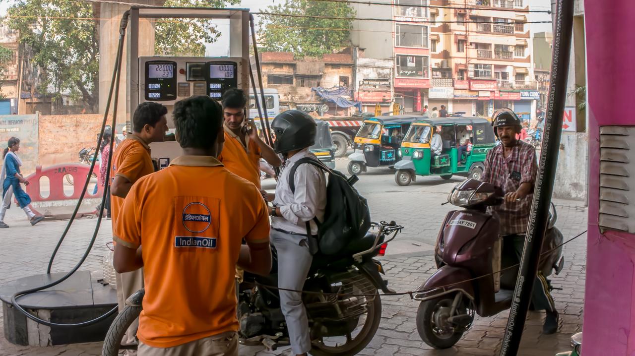 Motorcyclists seen at gas station refueling in India, March 26, 2026. (AA Photo)