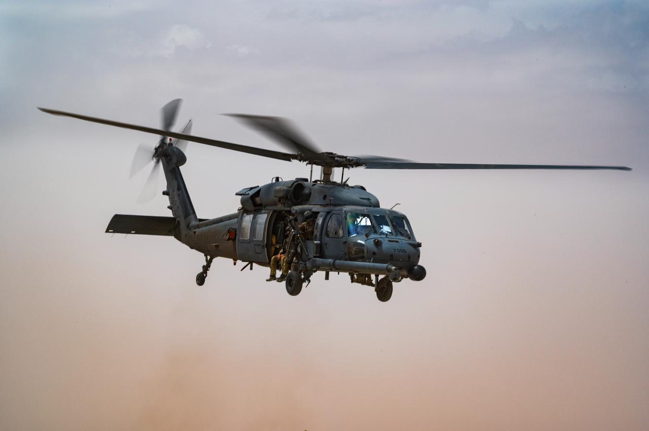 U.S. Air Force Pararescuemen, assigned to the 52nd Expeditionary Rescue Squadron, take off in an HH-60 Pave Hawk for a combat search and rescue exercise at an undisclosed location, April 28, 2022. (Photo via U.S. Air Force)