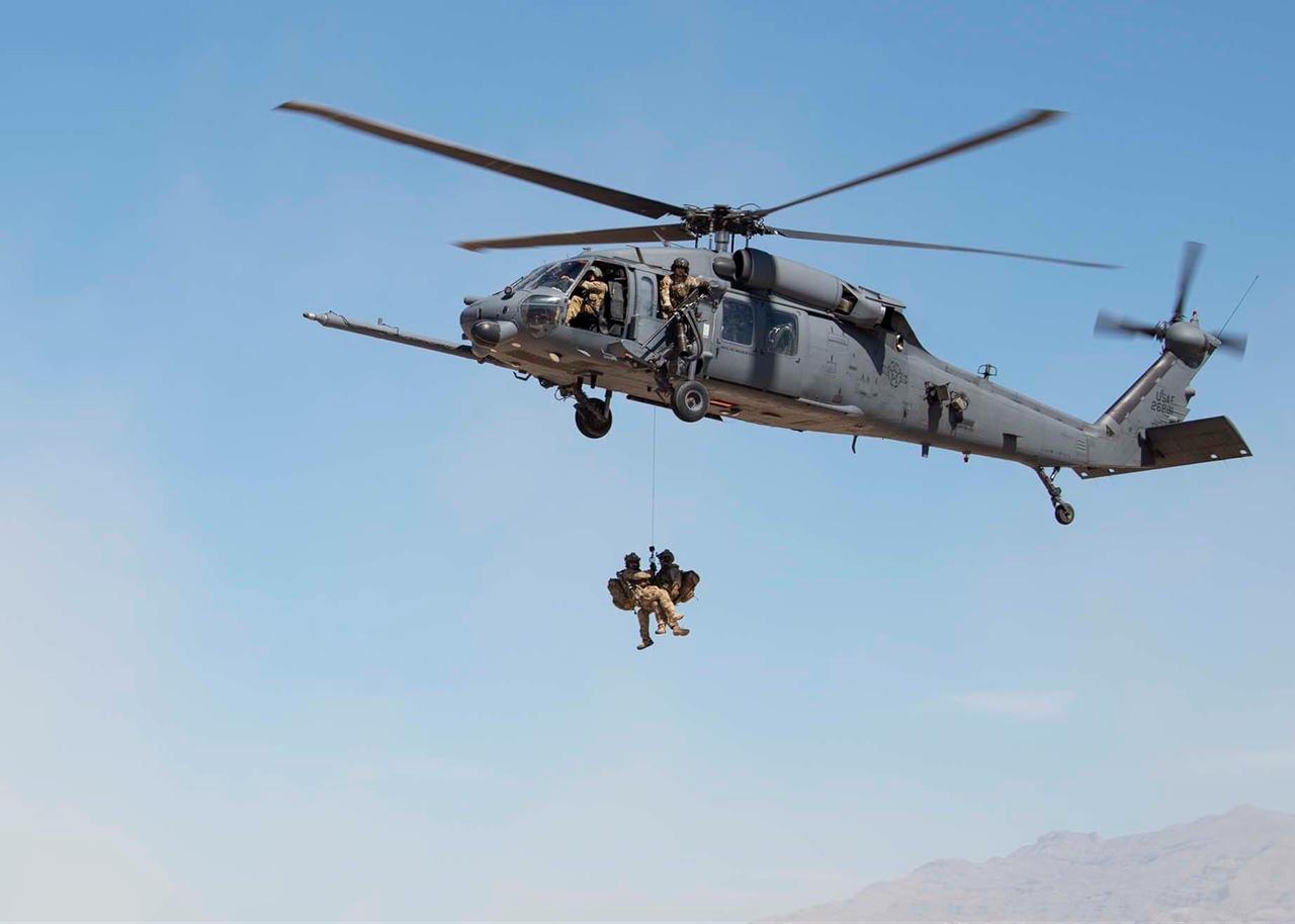 Pararescuemen assigned to the 66th Rescue Squadron (RQS) rappel from an HH-60G Pave Hawk helicopter at Nellis Air Force Base, Nev., June 26, 2019. (Photo via U.S. Air Force)