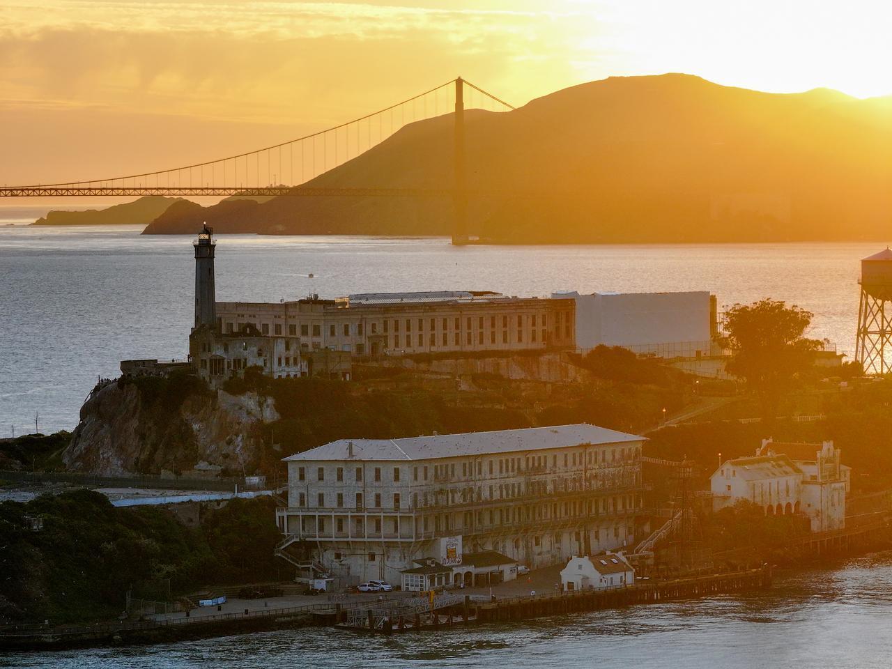 A view of Alcatraz Island and Golden Gate Bridge during sunset in San Francisco, California, United States on April 4, 2026 as U.S President Trump seeks $152 million to rebuild and reopen Alcatraz Island as a secure prison. (AA Photo)
