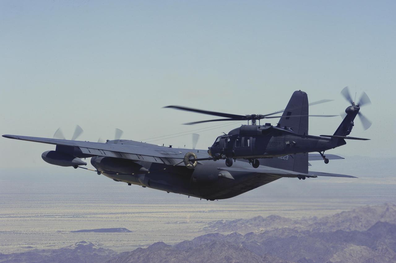 An MC-130P Combat Shadow from the 130th Rescue Squadron refuels an HH-60G Pave Hawk from the 66th RQS during a flight to southern California for a mass casualty exercise during Angel Thunder 2015, June 11, 2015. (Photo via U.S. Air Force)