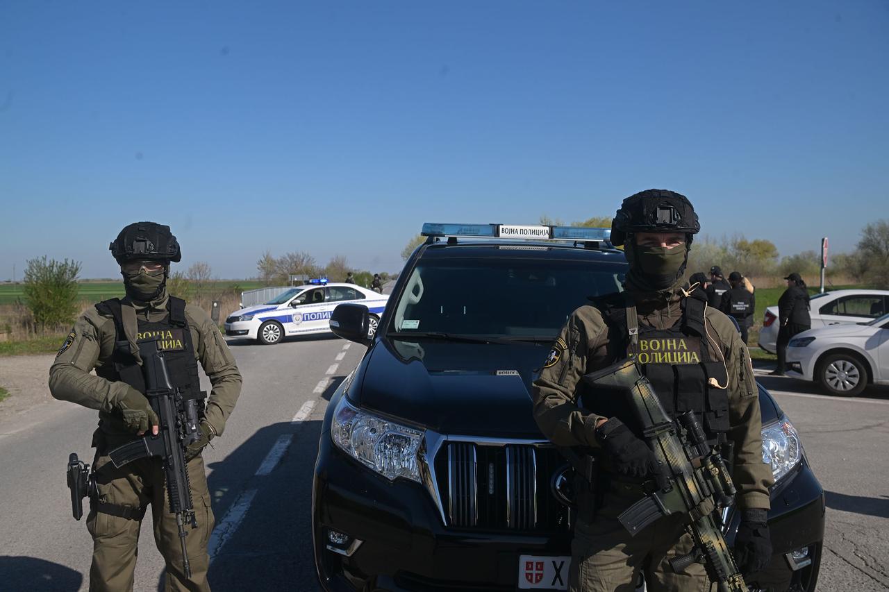 Serbian military police officers stand guard near vehicles as explosive materials of high destructive power are reported found in Kanjiza, Serbia, on April 6, 2026. (AA Photo)