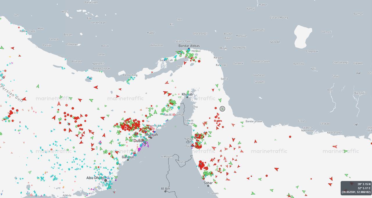 A screenshot shows dense clusters of tankers and cargo vessels around the Strait of Hormuz. (Image via MarineTraffic)