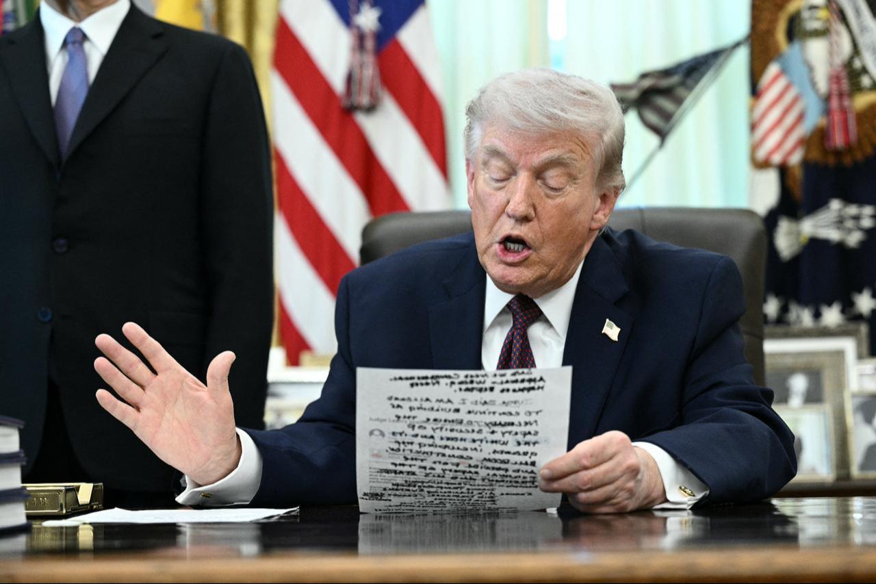 US President Donald Trump speaks to the press after signing an executive order in the Oval Office of the White House in Washington, DC, on March 31, 2026. (AFP Photo)
