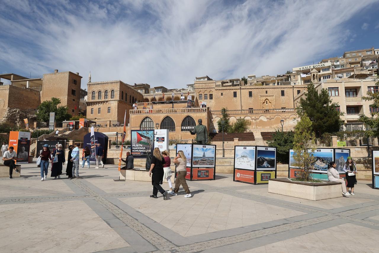 Visitors walk past exhibition panels during the Culture Route Festival in Mardin, Türkiye, in an undated handout photo. (Photo via Türkiye Kültür Yolu Festivali)