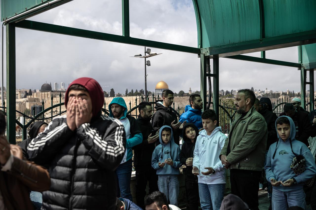 Palestinians perform Friday prayer on the streets in East Jerusalem on March 27, 2026, as Israel continues to impose restrictions on Palestinians from entering the Dome of the Rock of Masjid Al-Aqsa. (AA Photo)