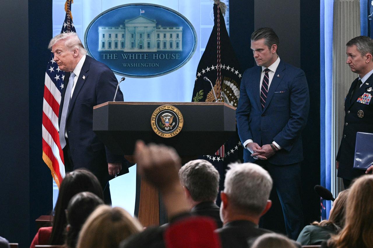 (L/R) US President Donald Trump, Secretary of Defense Pete Hegseth, and Chairman of the Joint Chiefs of Staff General Dan Caine depart after speaking about the conflict in Iran, April 6, 2026, in Washington, DC. (AFP Photo)