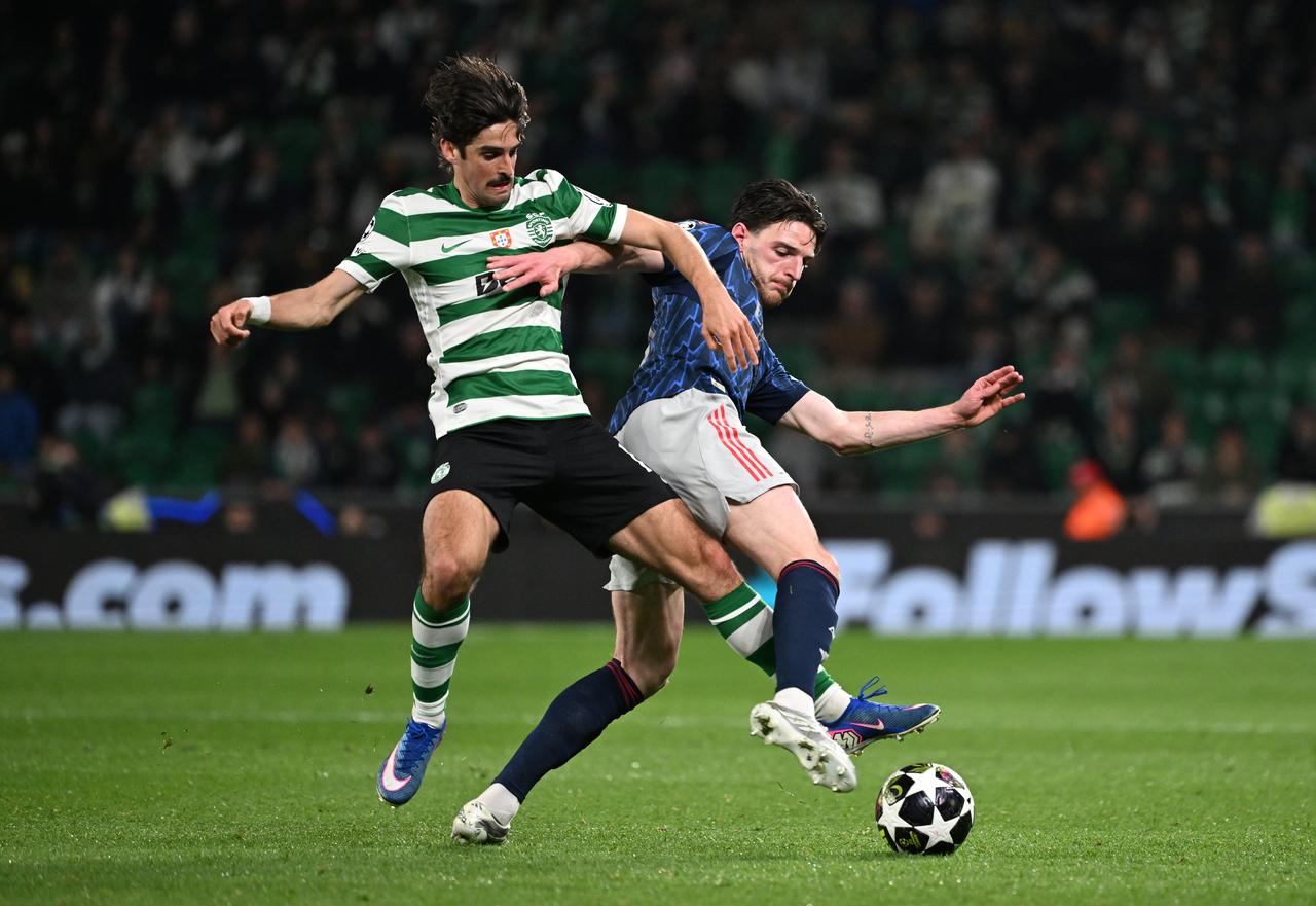 Declan Rice of Arsenal and Francisco Trincao of Sporting challenge for the ball during the UEFA Champions League 2025/26 Quarter-Final First Leg match between Sporting Clube de Portugal and Arsenal FC at Estadio Jose Alvalade in Lisbon, Portugal, April 7, 2026. (AA Photo)