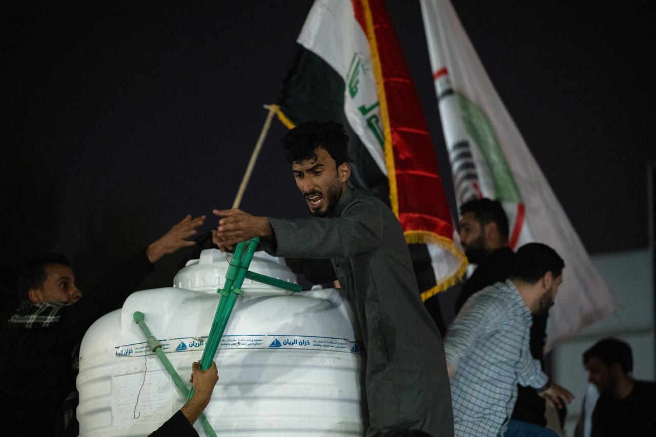 Iraqis hold a protest outside the Kuwaiti Consulate, following a strike that killed three people in a nearby town, in the southern Iraqi city of Basra on April 7, 2026. (AFP Photo)