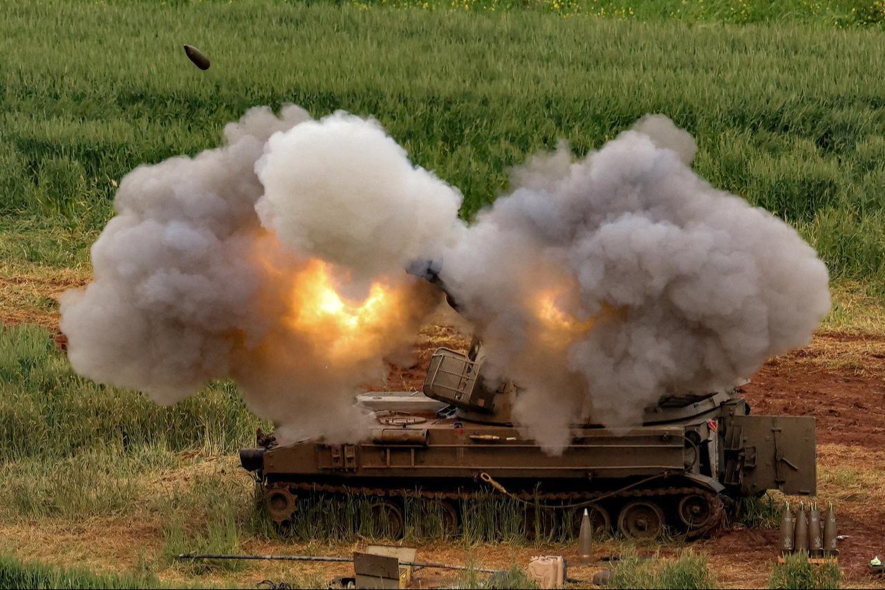 An Israeli self-propelled howitzer artillery gun fires rounds towards southern Lebanon from a position in the upper Galilee in northern Israel near the border, March 26, 2026. (AFP Photo)