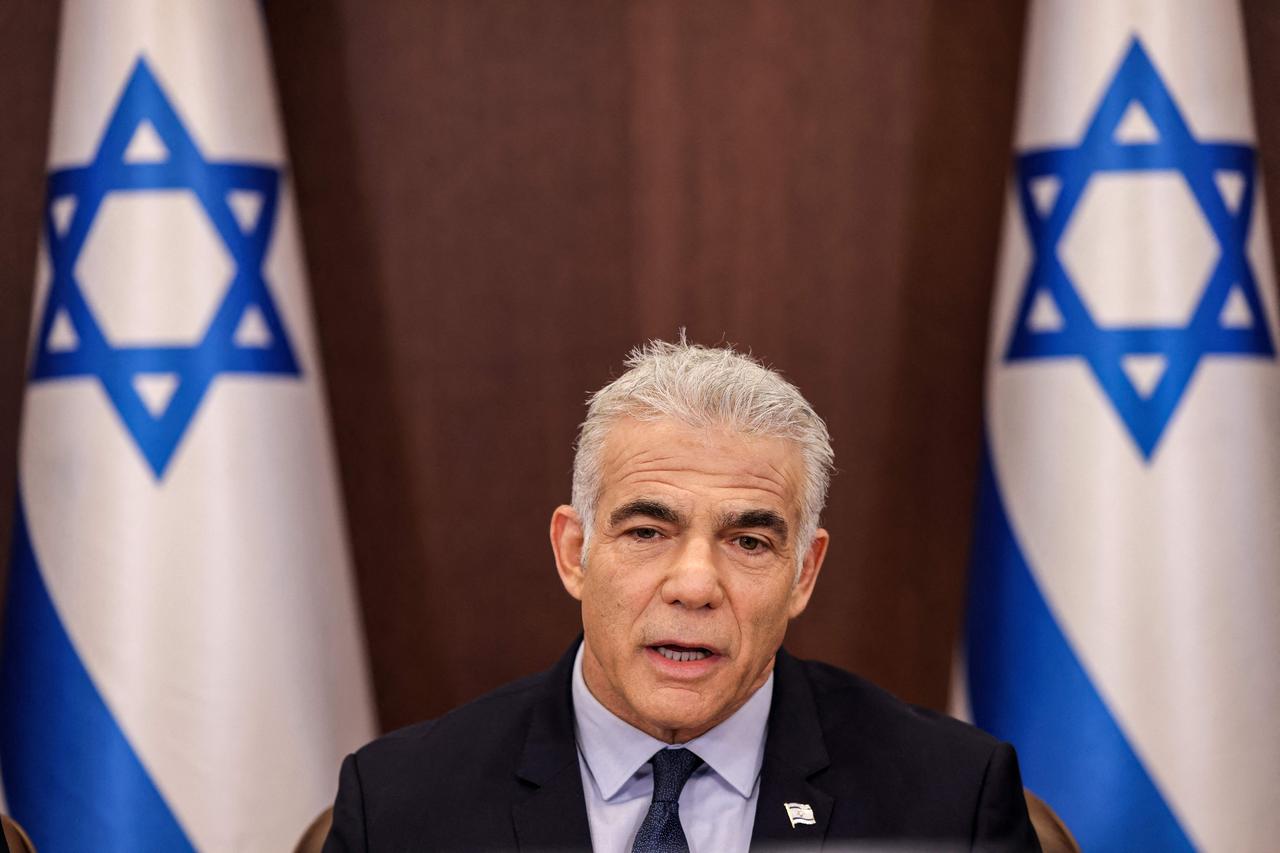 Israel's then-caretaker Prime Minister Yair Lapid attends the weekly cabinet meeting in Jerusalem, on September 18, 2022. (AFP Photo)