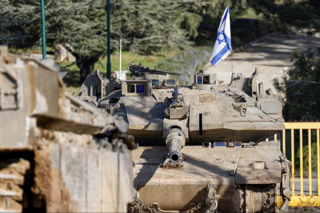 An Israeli army Merkava main battle tank is deployed by the concrete border wall at a position along Israel's northern border with Lebanon on February 18, 2025. (AFP Photo)