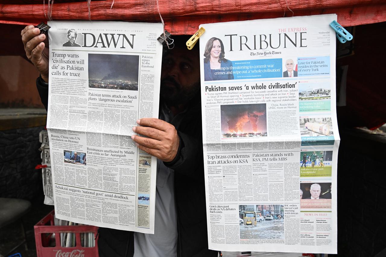 A vendor displays morning newspapers at his roadside stall in Islamabad on April 8, 2026. (AFP Photo)