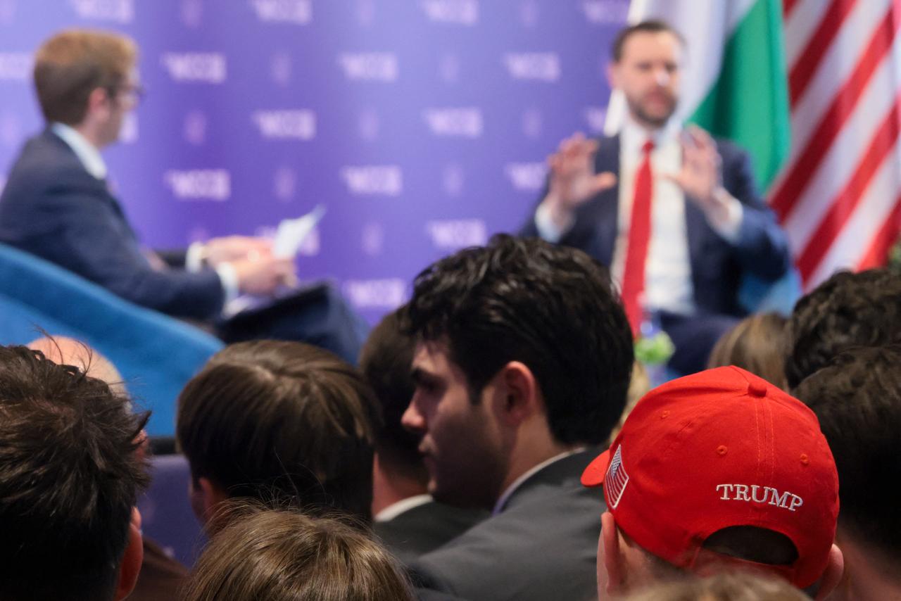 A member of the audience wears a cap in support of US President Donald Trump as US Vice President JD Vance delivers remarks at Mathias Corvinus Collegium in Budapest on April 8, 2026. (AFP Photo)