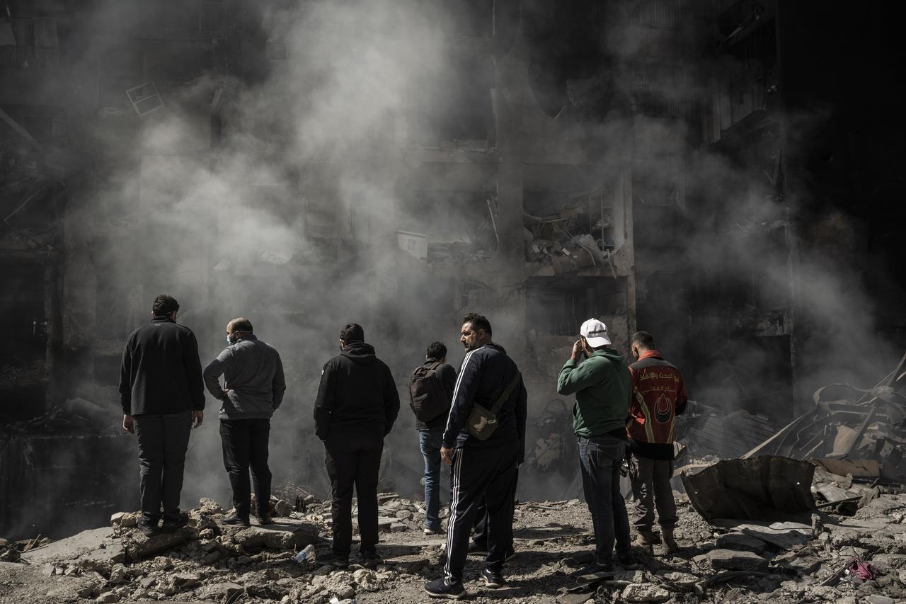 Civilians inspect the site as a residential building lies in ruins and surrounding structures show heavy damage after an Israeli strike hits Corniche Al-Mazraa district in Beirut, Lebanon on April 09, 2026. (AA Photo)