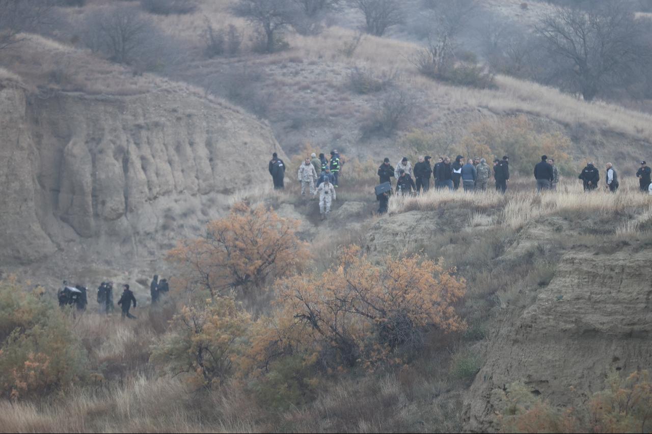 Search and rescue as well as crash investigation teams doing their examinations at the wreckage site of the military cargo plane that crashed on the Azerbaijan-Georgia border, on November 12, 2025. (AA Photo)