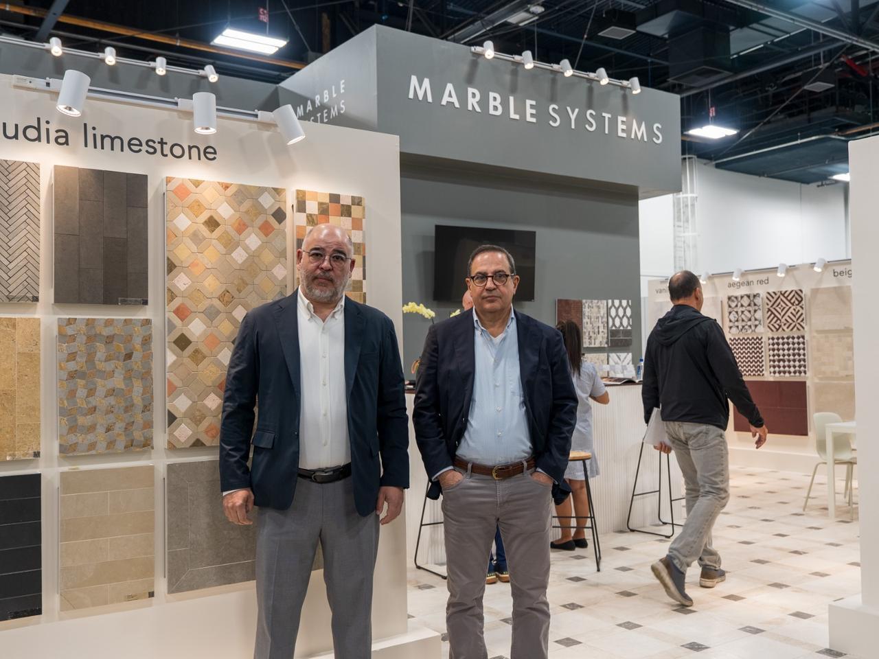 Executives pose at the Marble Systems stand at the Coverings 2026 fair in Las Vegas, United States. (Courtesy of Marble Systems Tureks)