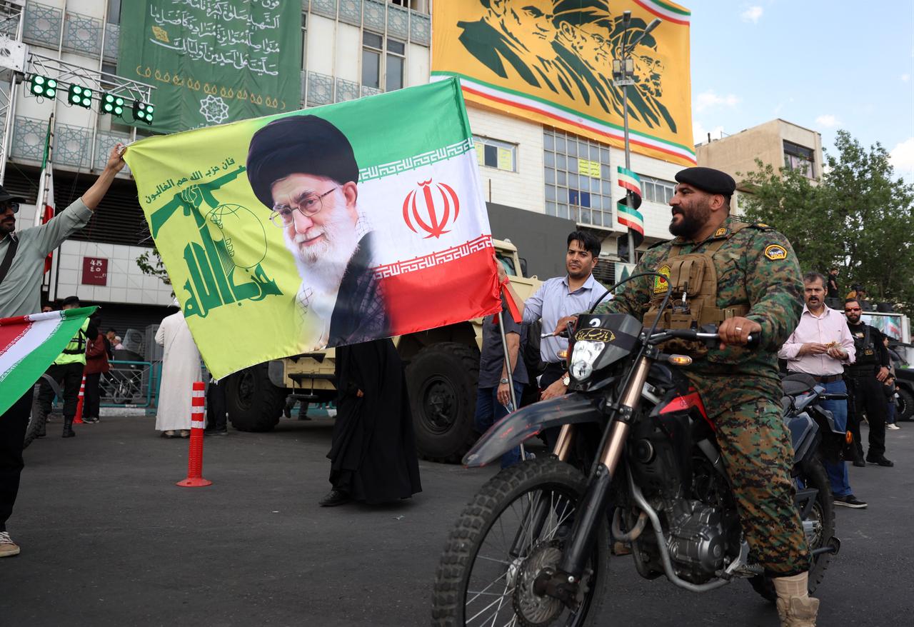 A member of the Iranian police stand guard on a motorbike during a rally to show solidarity and support to the new Iranian supreme leader Mojataba Khamenei in Tehran, Iran, April 29, 2026. (AFP Photo)