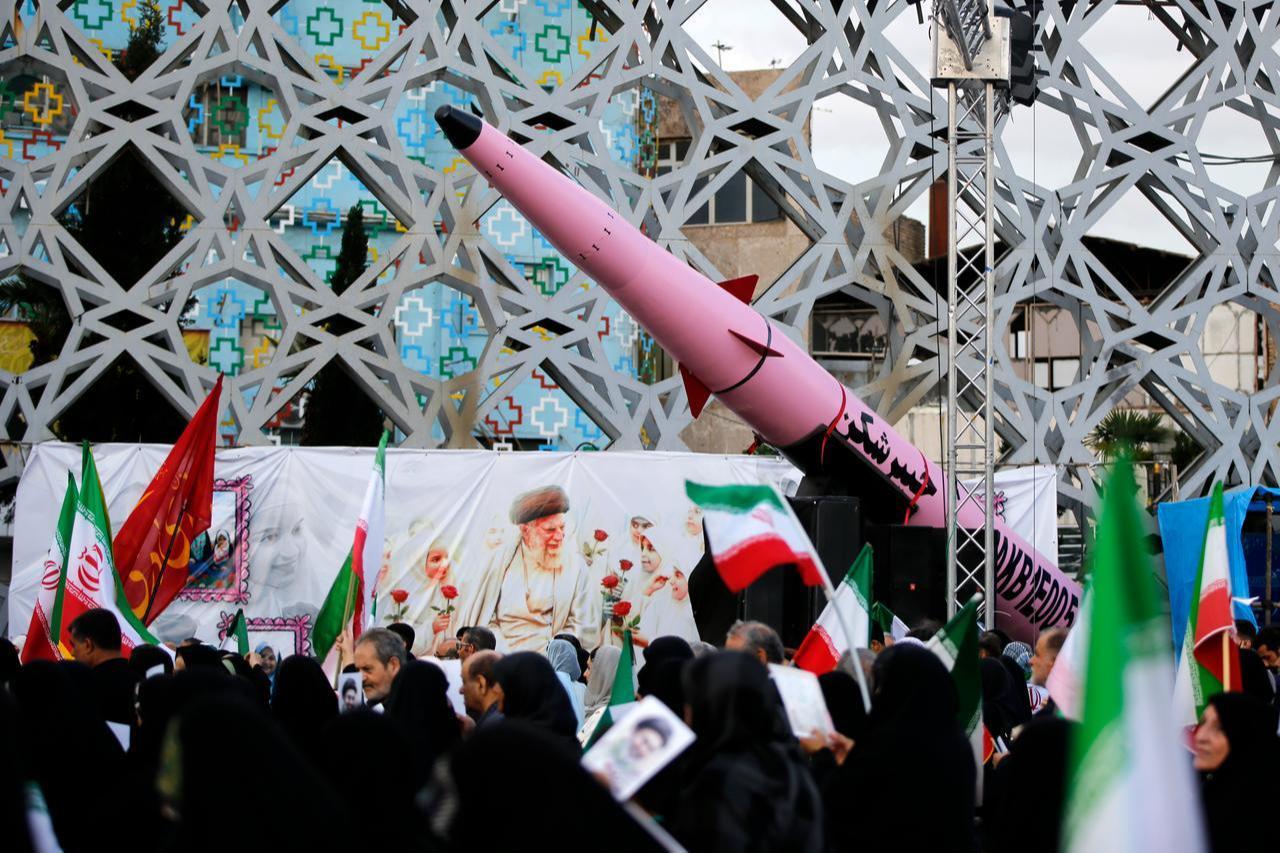 Iranians carry flags as they participate in a march pledging loyalty to new leader Mojtaba Khamenei in Tehran, Iran, April 29, 2026. (AA Photo)