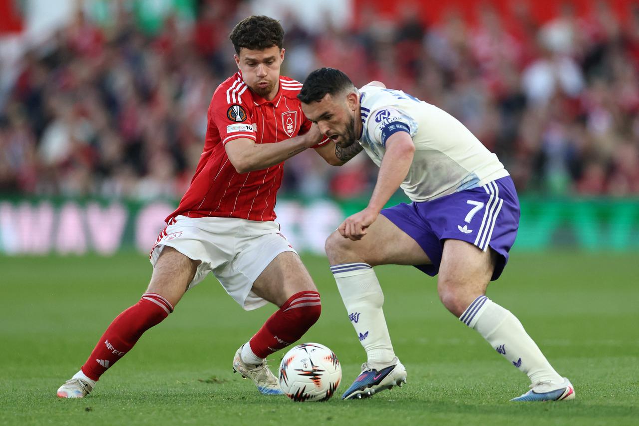 Nottingham Forest's Welsh defender #03 Neco Williams (L) and Aston Villa's Scottish midfielder  #07 John McGinn vie for the ball during the UEFA Europa League semi-final first-leg football match between Nottingham Forest and Aston Villa at The City Ground in Nottingham, central England, April 30, 2026. (AFP Photo)