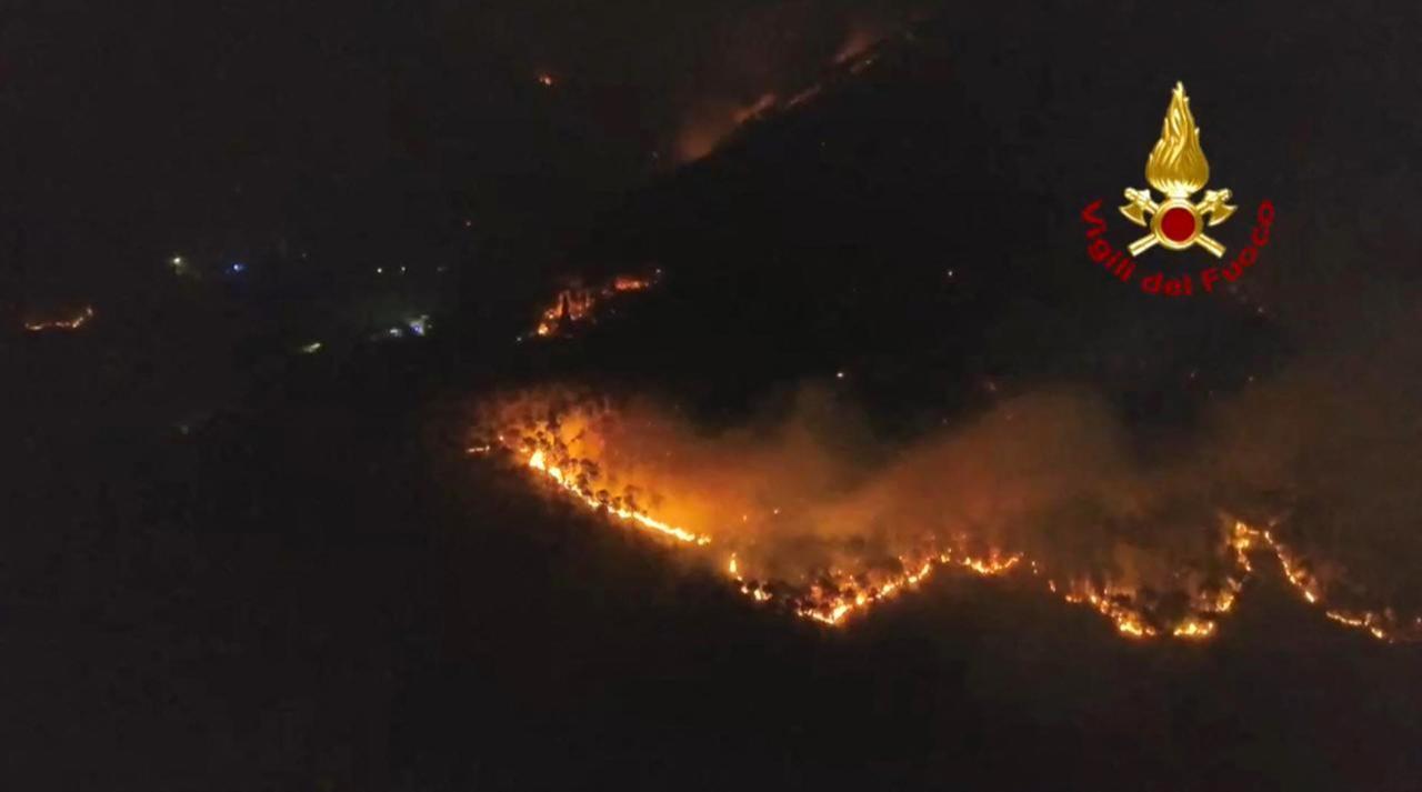 This photo taken and handout on May 1, 2026 by the Vigili del Fuoco, the Italian Corps. of Firefighters, shows a major fire on Mount Faeta in the area between the provinces of Lucca and Pisa in the Tuscany region. (AFP PHOTO /HANDOUT/ VIGILI DEL FUOCO)