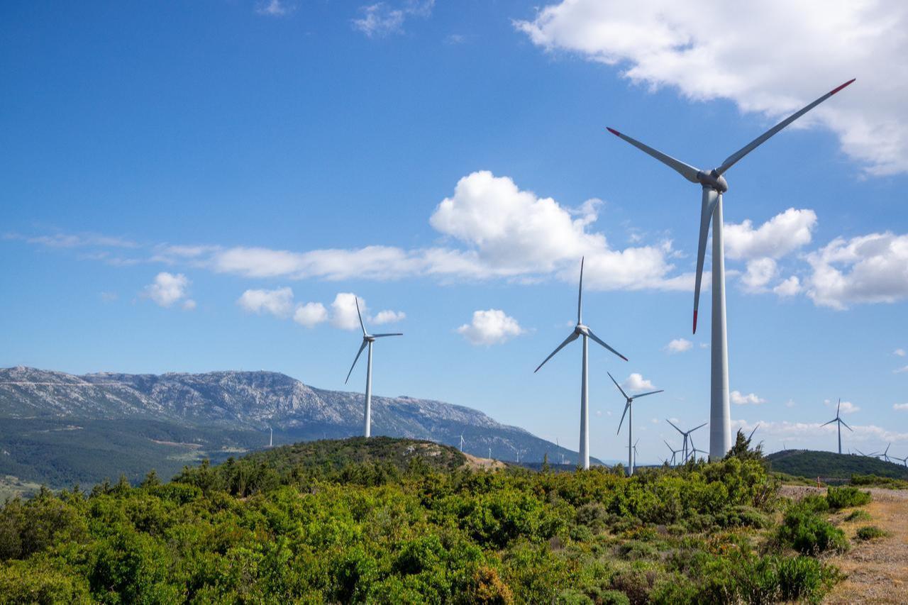 Wind turbines generate electricity at a wind farm in the hills of Izmir, Türkiye. (Adobe Stock Photo)