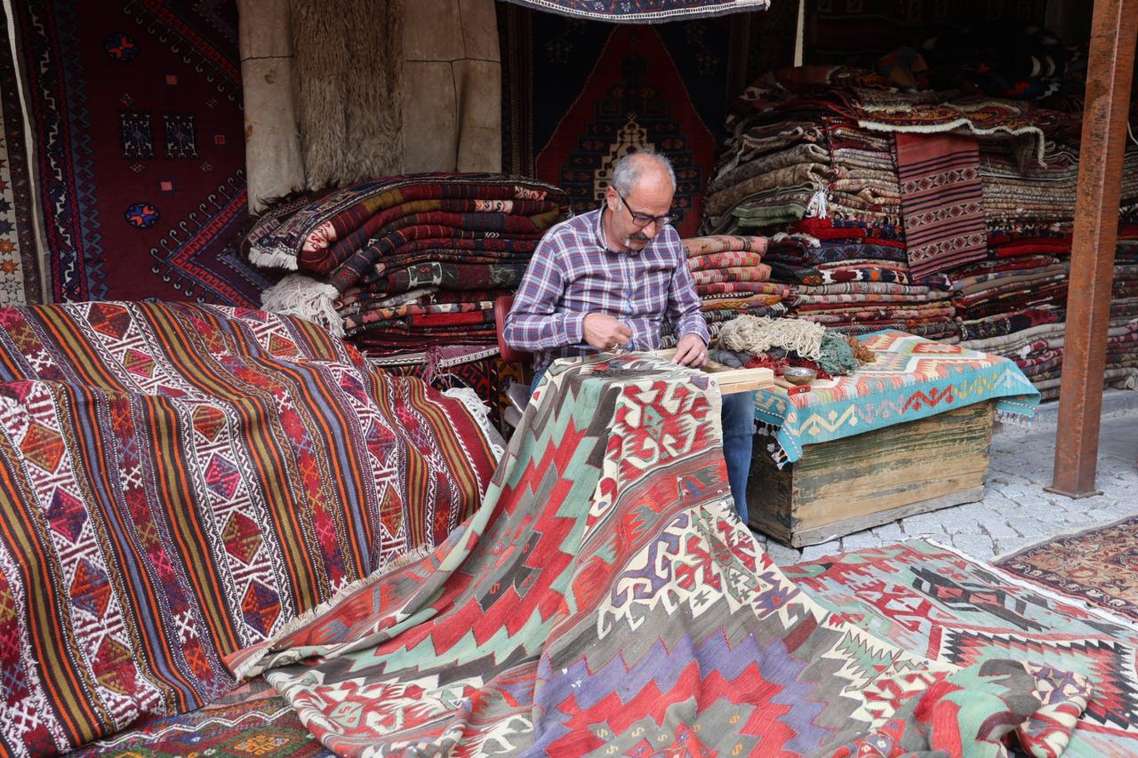 Carpet restoration expert turns worn carpets back into treasure one stitch at a time