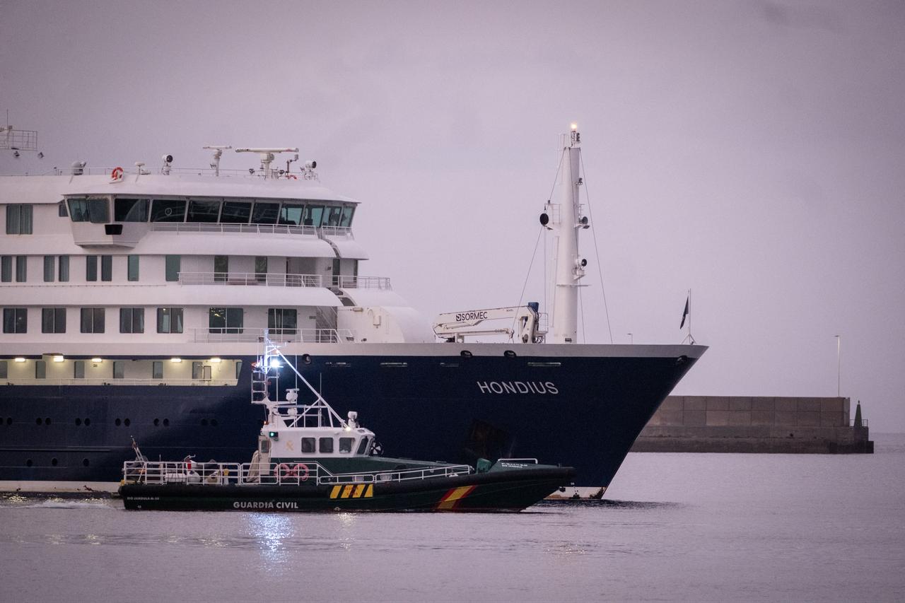 The cruise ship Hondius, carrying suspected hantavirus cases, approaches the Port of Granadilla as a Spanish Civil Guard vessel escorts it off the coast of Tenerife, Canary Islands, Spain on May 10, 2026. (AA Photo)