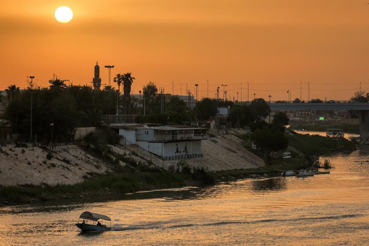 The sun sets over a portion of the Tigris River in central Baghdad, Iraq, on May 4, 2026. (AFP Photo)