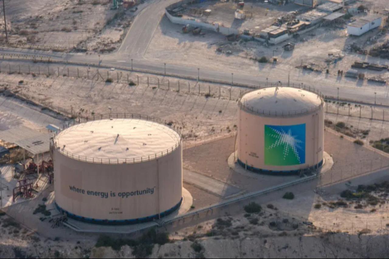 Aerial view of oil storage tanks bearing the Saudi Aramco logo at an energy facility in Saudi Arabia, date and time undisclosed. (AFP Photo)